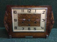 An oak Art Deco mantle clock with key