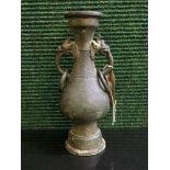 A Chinese patinated bronze archaic twin handled vase,