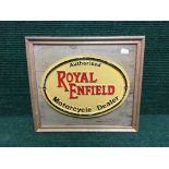 A cast iron Royal Enfield motorcycle dealer plaque on pine board