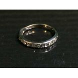 An 18ct white gold diamond set half eternity ring, 4.