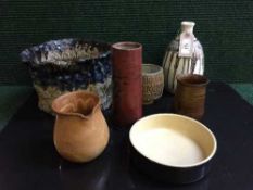 A tray of seven pieces of studio pottery - vases, shallow dish, planter,
