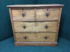 An antique ash four drawer chest
