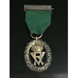 A silver Volunteer decoration in Garrards box