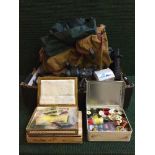 A box of fishing equipment including flies and making equipment, reels,