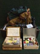 A box of fishing equipment including flies and making equipment, reels,