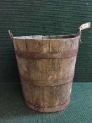 An antique metal bound wooden planter