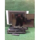 A Polaroid 2 inch LCD TV with remote,