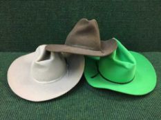 A box of three Stetsons (two by The American Hat Company and one by Brenham Saddle Shop,