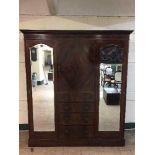 A Victorian inlaid mahogany compactum wardrobe