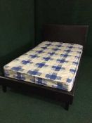 A 4' leather bed frame and mattress