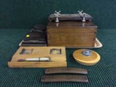 A tray of inlaid tie press, desk stands, wooden table lighter,