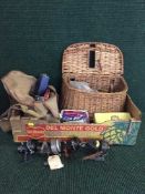 A box of wicker fishing creel, basket, reels,