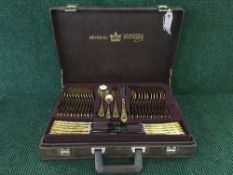 A canteen of Solingen cutlery with gilt handles