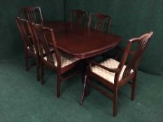 A Stag Minstrel extending dining table and six chairs