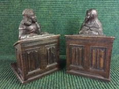 A pair of early twentieth century carved oak bookends - Figures praying