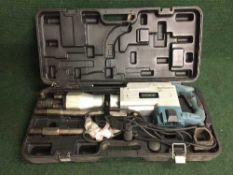 A cased Erbauer concrete breaker together with a task master socket set and drill bit set