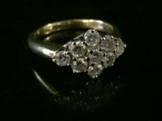 An 18ct gold 9 stone diamond ring, approx 1.