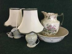 Two white marble table lamps together with a pair of ceramic table lamps and china jug with basin