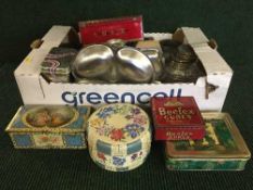 Two boxes of stainless steel kitchen ware, assorted tins,