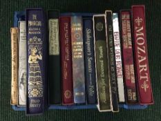 A crate of twelve Folio Society volumes including A Treasury of Mark Twain,