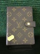 A Louis Vuitton notebook
