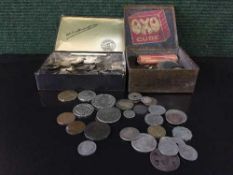 Two vintage tins containing assorted English coins,