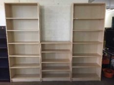 Three sets of beech effect open shelves