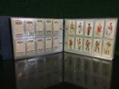 A bound folio of cigarette cards of military interest : Uniformsof the Territorial Army by John