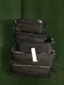 Five assorted luggage cases
