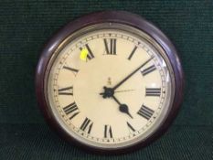 A GPO wall clock together with a worker's hat