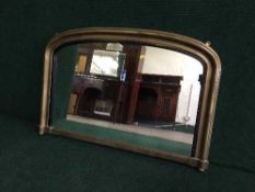 An early twentieth century gilt framed overmantle mirror