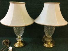 A pair of lead crystal and brass table lamps with shades