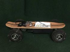 An Eight Ball Bigfoot electric skateboard, with charger, with hand-held controller,