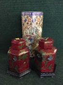 Two Oriental ceramic temple jars on wooden bases together with a stick stand