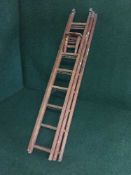 A set of wooden extension ladders