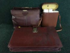 A leather gladstone bag, leather briefcase,