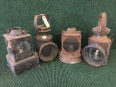 A tray of vintage railway lamps