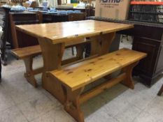 A pine refectory table and two benches