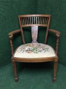 A Victorian inlaid mahogany elbow chair