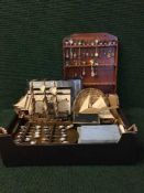A box of wooden galleons, four spoon racks, quantity of crested spoons, boxed cutlery etc.