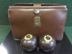 A leather bag of seven composite bowling balls