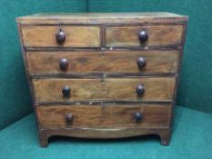 A Victorian inlaid mahogany five drawer chest with handles