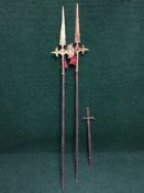 Two reproduction halberds together with an ornamental brass handled sword