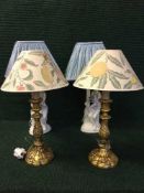 A pair of chalk table lamps with shades depicting maidens,