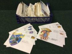 A box of First Day covers and 1997 five pound coin