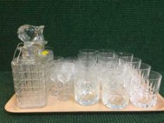 A tray of glass decanters and stoppers,