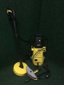 A Karcher pressure washer and accessories