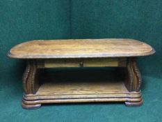 An oak two tier coffee table fitted a drawer