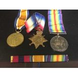 A box of a trio of WWI Durham Light Infantry medals with ribbons