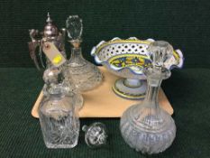 A tray of Continental pottery comport, three glass decanters with stoppers,